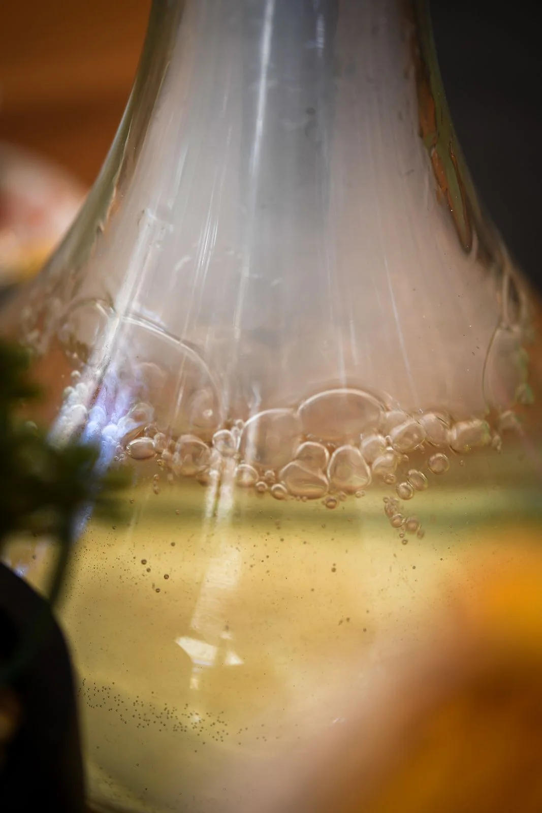 Macro shot of a hookah's glass base with bubbles in the water